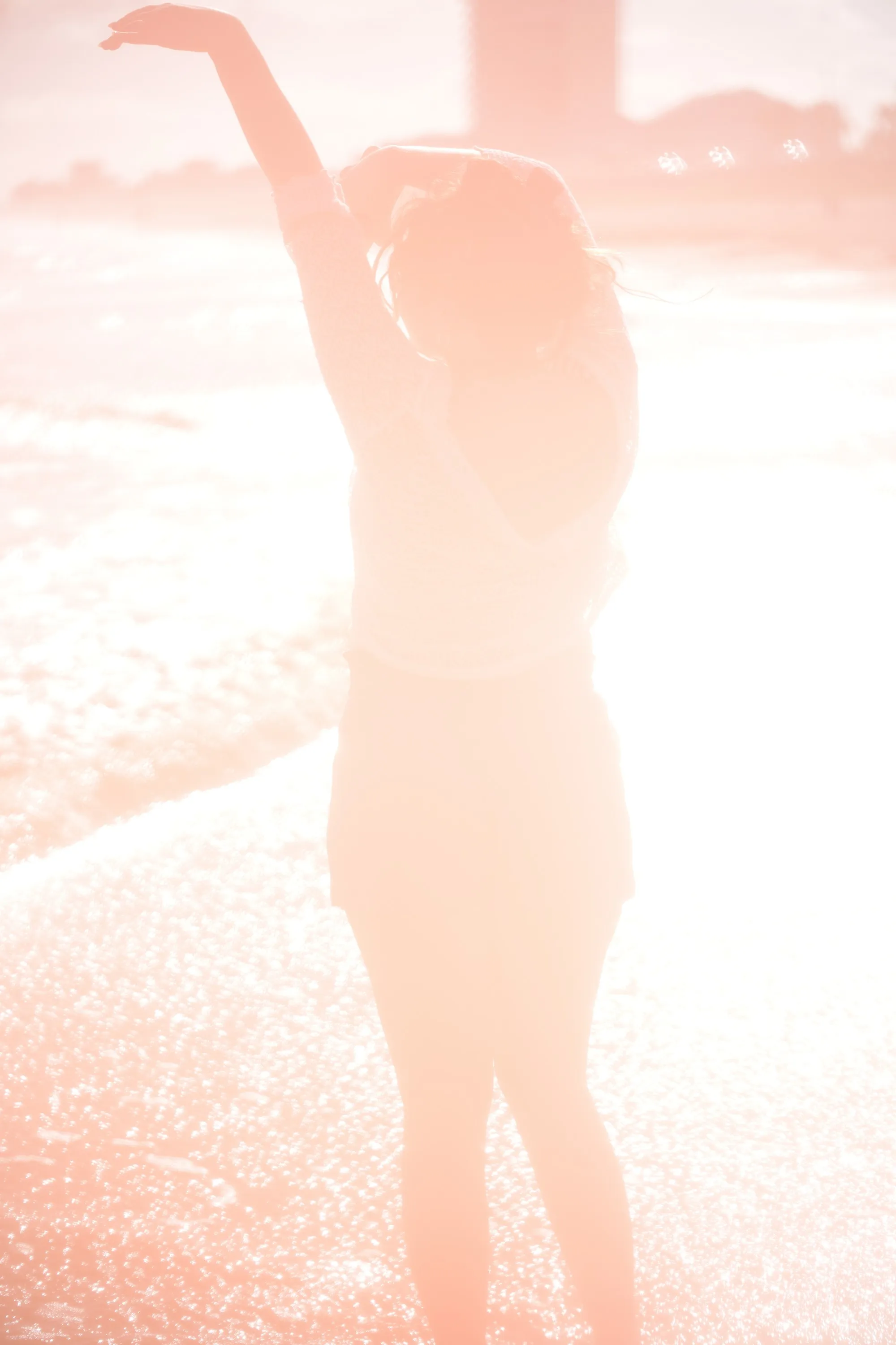 Overexposed pastel portrait by the shore — lace, sand and backlight — 4