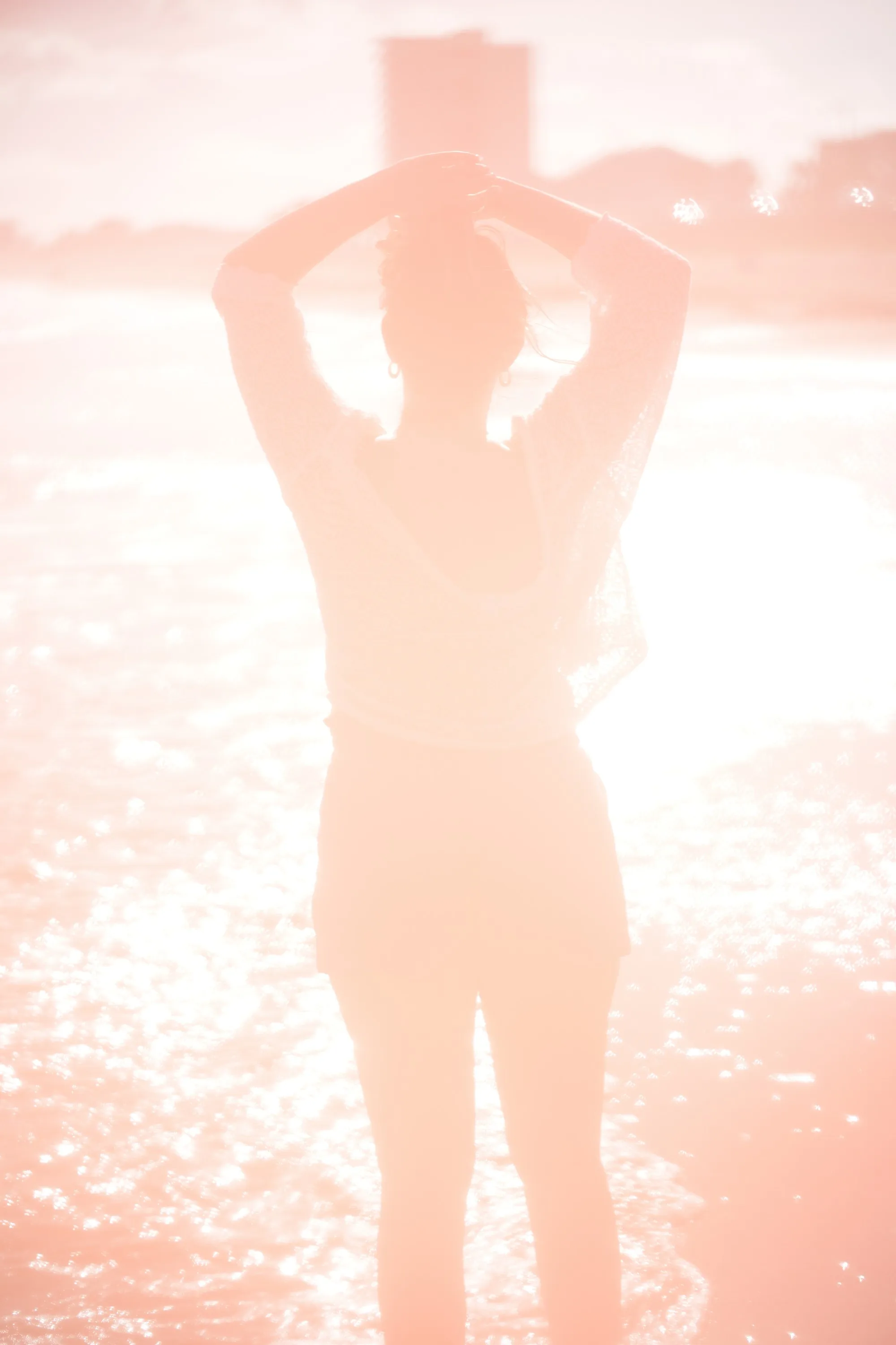 Overexposed pastel portrait by the shore — lace, sand and backlight — 6